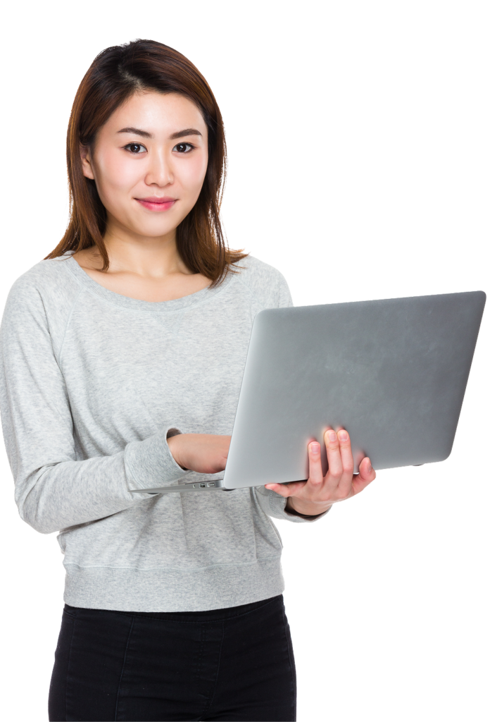 A thoughtful female entrepreneur working on a laptop at her desk, searching for corporate capital business solutions.